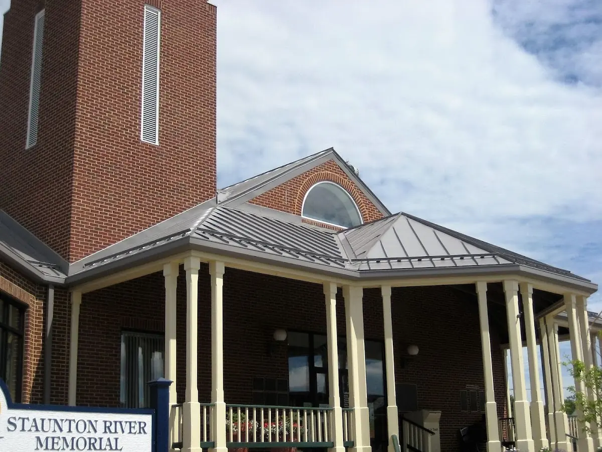 Skilled roofing craftsmen working on a residential roof in Brock Hall